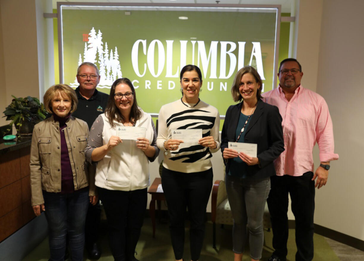 Sharing the proceeds of the McKibbin Classic are, from left, Nancy McKibbin, Steve Kenny, Michelle Marra, Heather Martin, Emily Gilliland and Rick Takach.