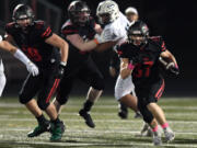 Camas senior Jon Schultz (37) runs down the field Friday, Oct. 22, 2021, during the Papermakers’ 17-7 win against Skyview at Camas High School.