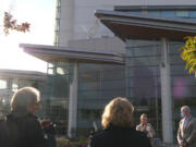 Community members gather for the unveiling of a new statue of a dove at PeaceHealth Southwest Medical Center's Firstenburg Tower.