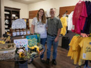 Joy and Mark Bochsler at their new shop, Joyful Honey and Beekeeping Supplies, in Battle Ground on Monday. The Bochslers sell honey, bee-themed merchandise, custom hives and beekeeping supplies, though a number of their initial product shipments have been delayed due to supply chain backups.