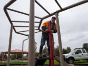 Don Wingate of the city of Washougal repairs an aging play structure at Hamllik Park in Washougal on Friday morning. Washougal city workers are wrapping up work on upgrades to the park, which will include replacing the play structure.