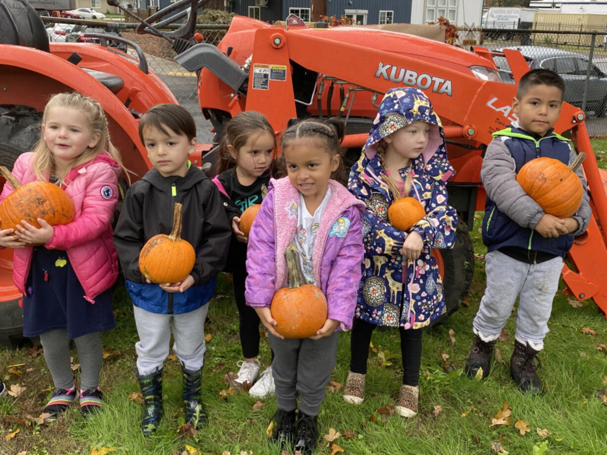 Hathaway Elementary School kindergarten students enjoy a pumpkin patch and activities at the school's playground Oct. 22.