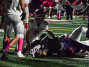 Jacob Williams (33) reaches in for a Seton Catholic touchdown against Castle Rock on Friday.