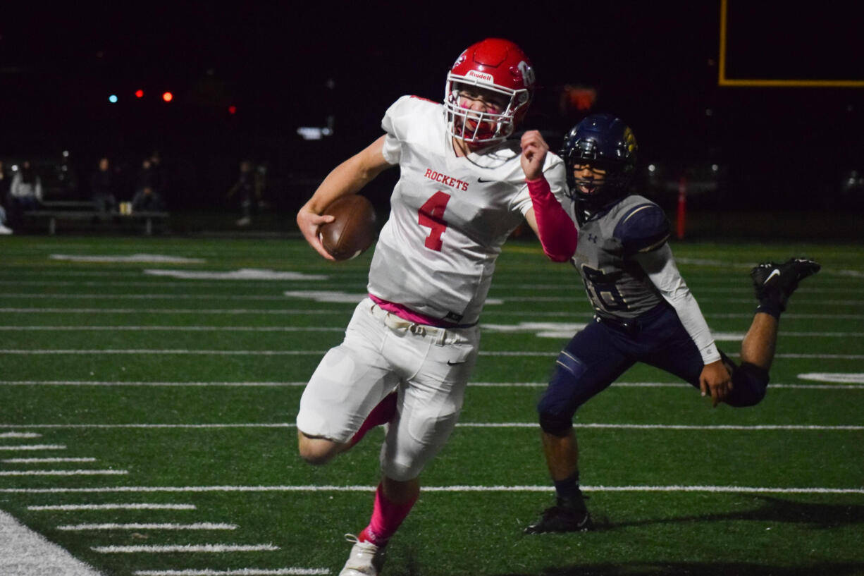 Castle Rock's Chance Naugle runs to the sideline to avoid a tackle from Seton Catholic's Amann Au (46) on Friday.