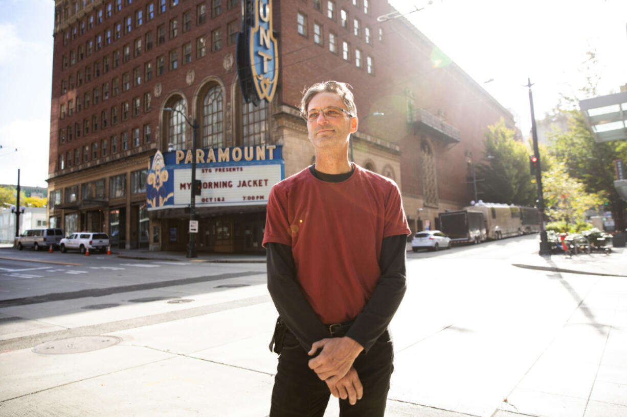 Christopher Smith is a stage hand working on setting up a show at the Paramount Theater in Seattle on Friday, Oct. 1, 2021. He is back to work as the pandemic lifts -- but the end of benefits isn't what made that happen.