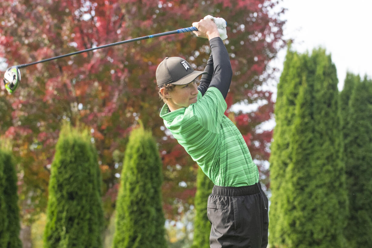 Woodland junior Dane Huddleston tees off on Day 1 of the 2A District 4 Boys Golf Tournament at Riverside Golf Course in Chehalis on Oct. 20, 2021.