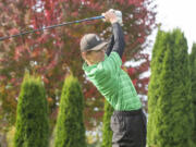 Woodland junior Dane Huddleston tees off on Day 1 of the 2A District 4 Boys Golf Tournament at Riverside Golf Course in Chehalis on Oct. 20, 2021.