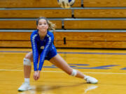 La Center volleyball senior Summer Senske readies to make a dig before a match.