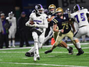 Heritage’s Aiden Miller looks for room to run against Kelso on Friday (Joshua Kirshenbaum/Longview Daily News)