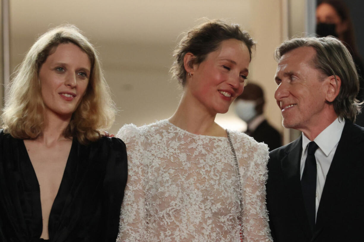 Luxembourg actress Vicky Krieps and British actor Tim Roth arrive July 11 for the screening of the film "Bergman Island" at the 74th edition of the Cannes Film Festival in Cannes, southern France.