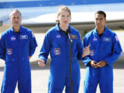 NASA astronaut Kayla Barron, a graduate of Richland High in Eastern Washington, center, answers questions during a news conference with astronauts Tom Marshburn, left, and Raja Chari after they arrived at the Kennedy Space Center in Cape Canaveral, Fla., Tuesday, Oct. 26, 2021. The mission with a crew of four astronauts will launch aboard a Crew Dragon spacecraft on a SpaceX Falcon 9 rocket from Kennedy Space Center Launch Complex 39A early Sunday morning to the International Space Station.