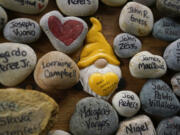 Rocks with the names of people that were victims of the coronavirus pandemic. In Washington, more than a thousand children lost a parent or caregiver to COVID-19.