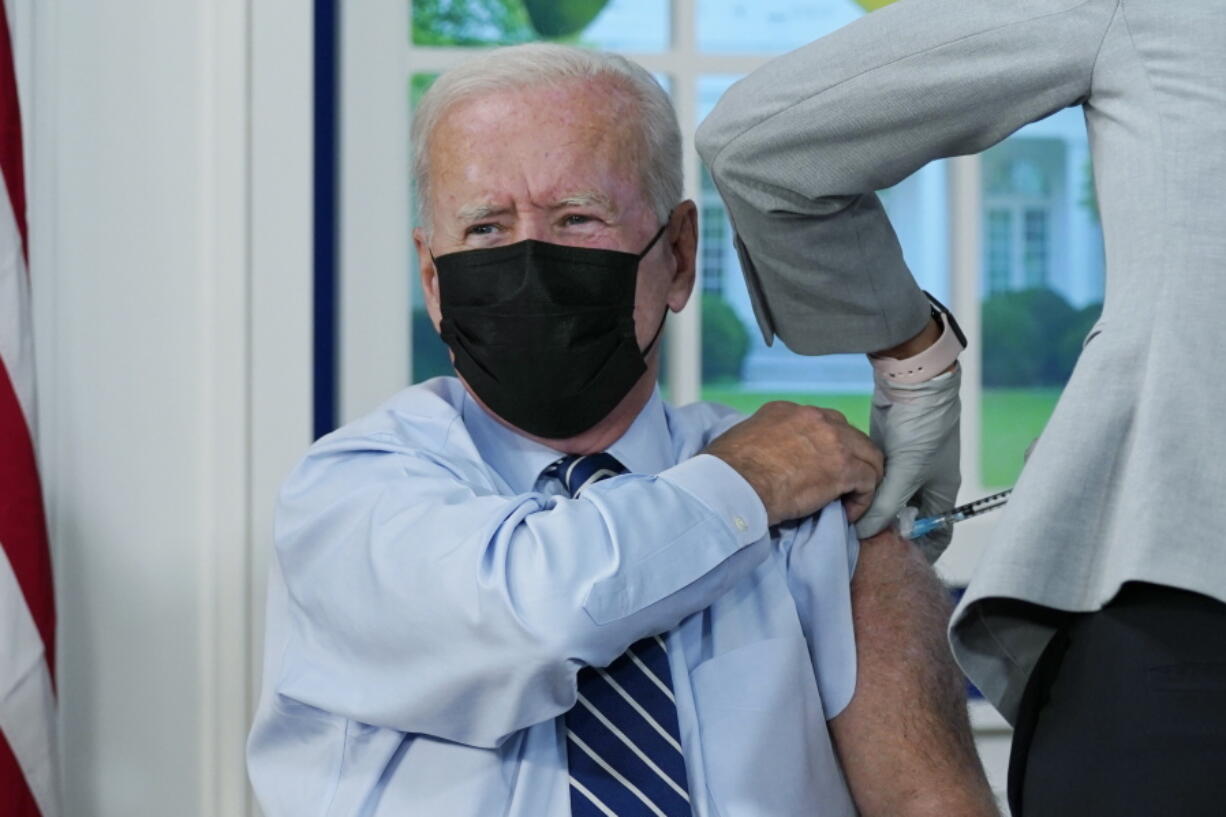 President Joe Biden receives a COVID-19 booster shot during an event in the South Court Auditorium on the White House campus, Monday, Sept. 27, 2021, in Washington.