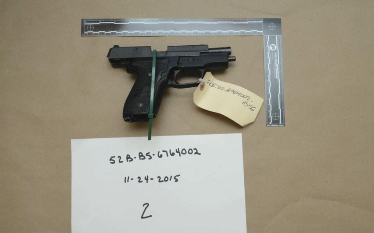 FILE - This evidence photo from the criminal complaint of the U.S. District Court for Massachusetts v. Ashley Bigsbee for illegal possession of a stolen firearm on Nov. 15, 2015, in Suffolk, Mass., shows one of ten M11 semiautomatic handguns that former Army Reserve member James Morales stole from the Lincoln Stoddard Army Reserve Center in Worcester, Mass. Overall, AP has found that at least 2,000 firearms from the Army, Marines, Navy or Air Force were lost or stolen during the 2010s. (U.S.