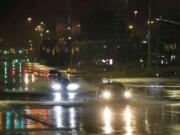 Car travel through floodwaters on Montgomery highway Wednesday, Oct. 6, 2021, near the Riverchase Galleria complex in Birmingham, Ala.