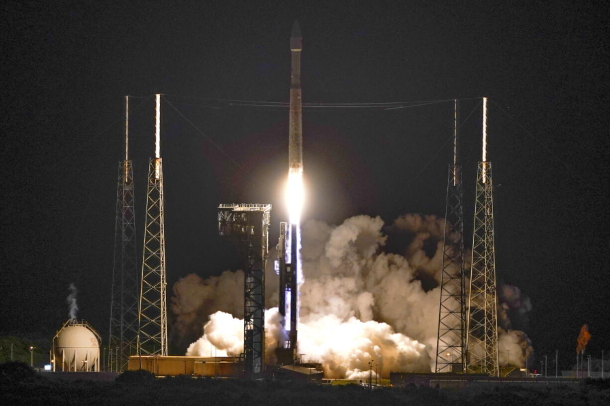 A United Launch Alliance Atlas V rocket carrying the LUCY spacecraft lifts off from Launch Complex 41 at the Cape Canaveral Space Force Station, Saturday, Oct. 16, 2021, in Cape Canaveral, Fla. Lucy, will observe Trojan asteroids, a unique family of asteroids that orbit the sun in front of and behind Jupiter.