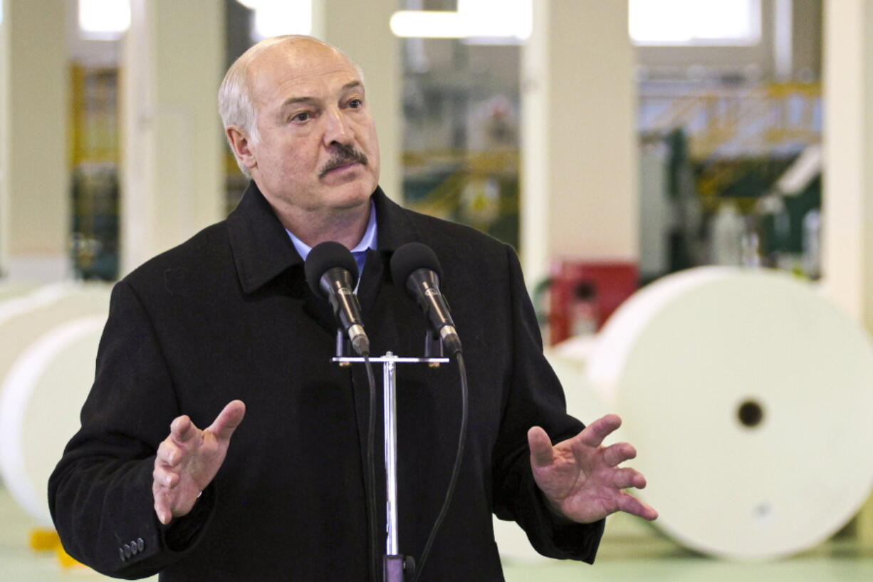 Belarus President Alexander Lukashenko gestures while speaking during his visit to the Dobrush Paper Mill "Geroy Truda" in Dobrush, Belarus, Friday, Oct. 29, 2021.