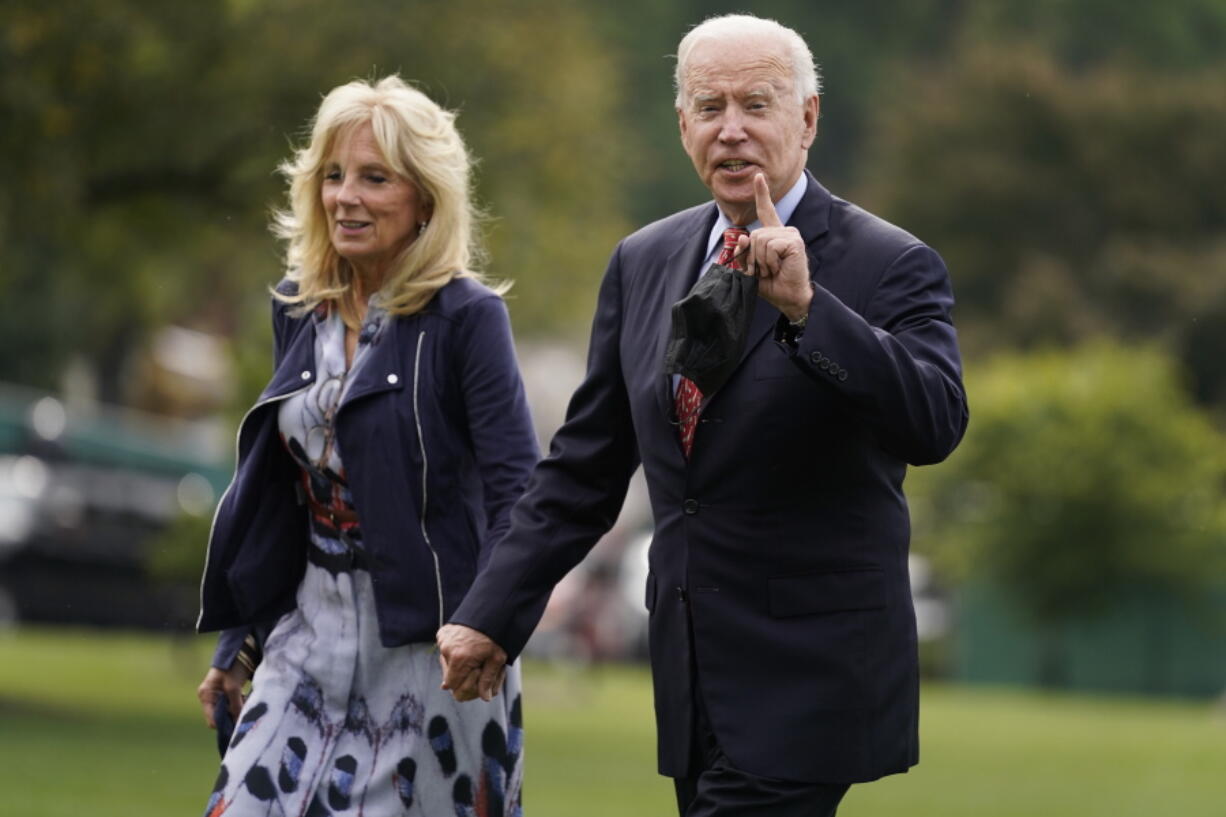 President Joe Biden and first lady Jill Biden arrive on the South Lawn of the White House after spending the weekend in Wilmington, Del., Monday, Oct. 4, 2021, in Washington.