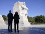 President Joe Biden and Vice President Kamala Harris stand together at the Martin Luther King, Jr. Memorial as they arrive to attend an event marking the 10th anniversary of the dedication of memorial in Washington, Thursday, Oct. 21, 2021.