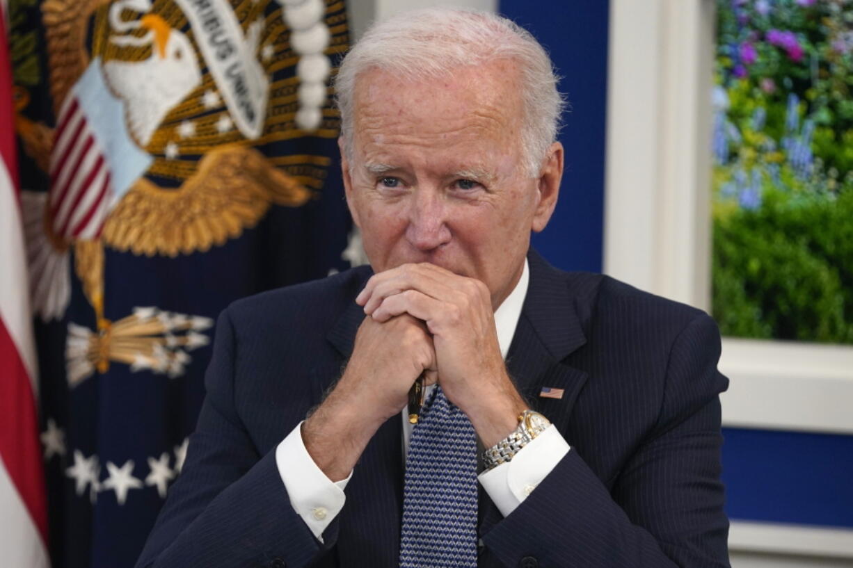 President Joe Biden listens during a meeting with business leaders about the debt limit in the South Court Auditorium on the White House campus, Wednesday, Oct. 6, 2021, in Washington.