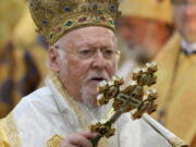 FILE - In this Sunday, Aug. 22, 2021 file photo, Ecumenical Patriarch Bartholomew I, the spiritual leader of the world's Orthodox Christians, leads a Mass at the St. Sofia Cathedral in Kyiv, Ukraine. Bartholomew I, the spiritual leader of Eastern Orthodox Christians, has been released from a Washington hospital after an overnight stay early in his 12-day visit to the United States.