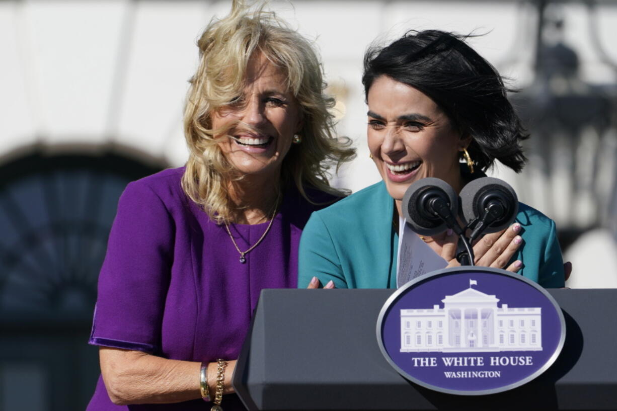 First lady Jill Biden comes over to comfort 2021 National Teacher of the Year Juliana Urtubey, a bilingual special education teacher in Las Vegas, who was emotional as she spoke during an event with 2020 and 2021 State and National Teachers of the Year on the South Lawn of the White House in Washington, Monday, Oct. 18, 2021.