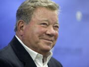 FILE - In this May 6, 2018 file photo, actor William Shatner takes questions from reporters after delivering the commencement address at New England Institute of Technology graduation ceremonies, in Providence, R.I. Star Trek's Captain Kirk is rocketing into space this month -- boldly going where no other sci-fi actors have gone. Jeff Bezos' space travel company, Blue Origin, announced Monday, Oct. 4, 2021 that Shatner will blast off from West Texas on Oct. 12.