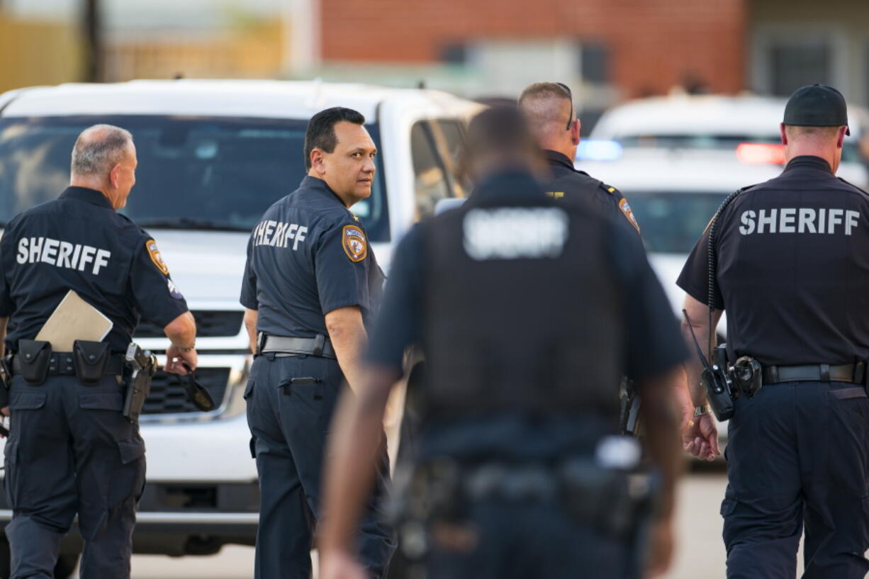 Harris County Sheriff Ed Gonzalez walks back to the scene where, according to Gonzalez, three juveniles were found living alone along with the skeletal remains of another person, possibly a juvenile, in a third floor apartment at the CityParc II at West Oaks Apartments on Sunday, Oct. 24, 2021, at in west Houston.