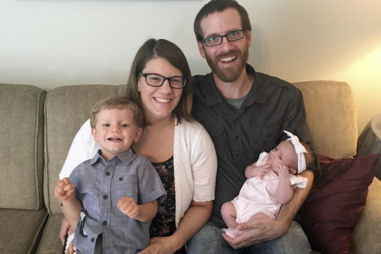 Rachel Held Evans and her husband, Dan Evans, with their children, Henry and Harper, in 2018 in Dayton, Tenn. Rachel Evans, a Christian author, died in May 2019 at the age of 37.