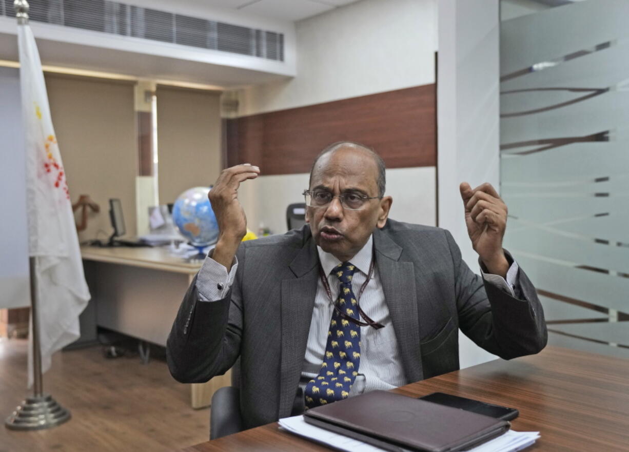 Ajay Mathur, director general of the International Solar Alliance, speaks to the Associated Press in his office in New Delhi, India, Wednesday, Oct. 27, 2021. India and the U.K. will launch a project that aims to create a solar grid connecting countries in different parts of the world at the upcoming U.N. climate talks in Glasgow, Scotland. The project, known as the "Green Grids Initiative," is being initiated by the International Solar Alliance, which was launched by India and France at the 2015 Paris climate conference to promote solar energy. The U.K. and India agreed to join forces in the initiative in May this year.