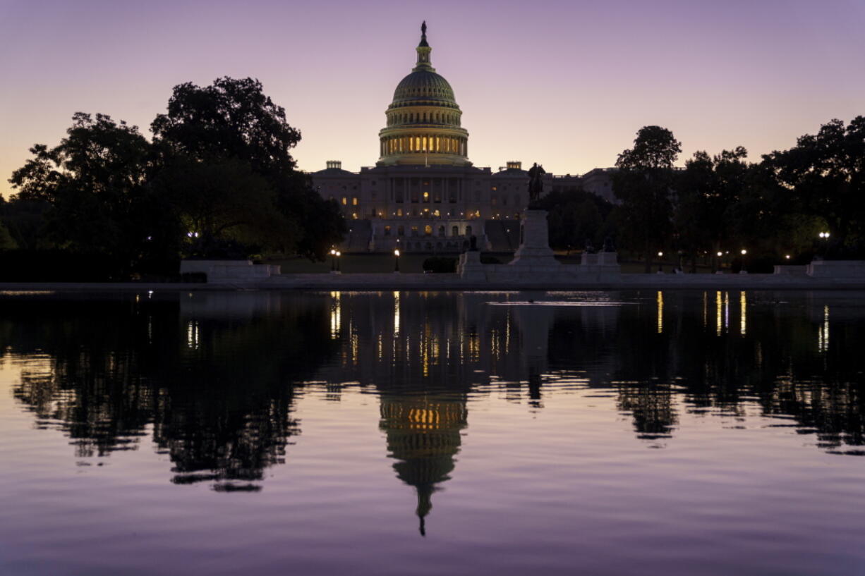 FILE - In this Sept. 27, 2021, file photo the Capitol is seen at dawn in Washington. (AP Photo/J.