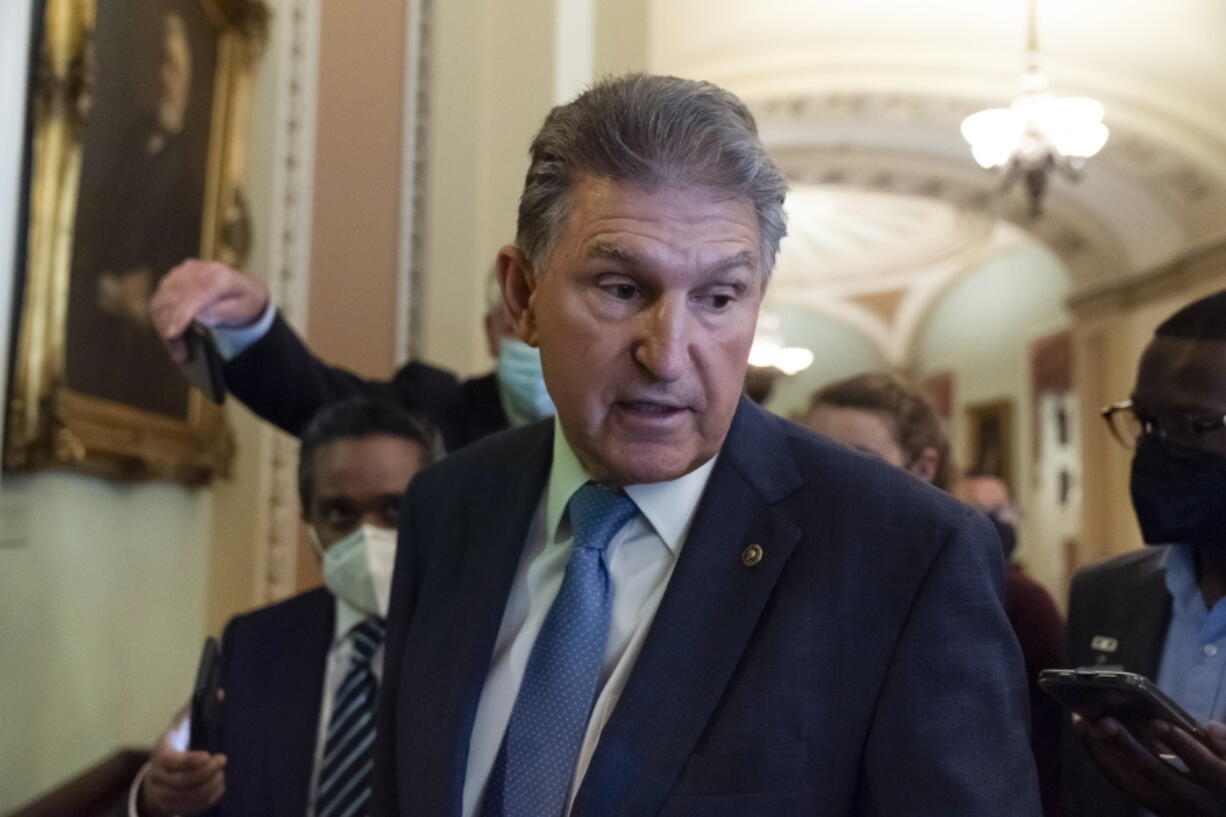 Sen. Joe Manchin, D-W.Va., speaks with reporters on Capitol Hill, Thursday, Oct. 7, 2021, in Washington.