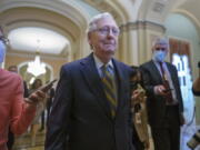 Senate Minority Leader Mitch McConnell, R-Ky., is surrounded by journalists as he walks to the Senate Chamber for a vote as Democrats look for a way to lift the debt limit without Republican votes, at the Capitol in Washington, Wednesday, Oct. 6, 2021. (AP Photo/J.