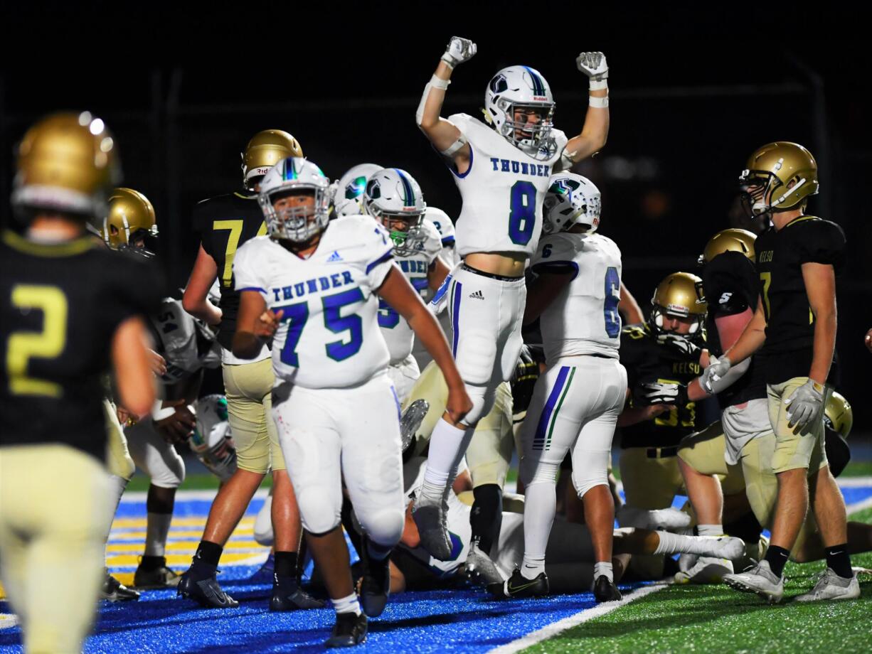 Mountain View senior Walker Richardson celebrates Mitch Johnson’s 1-yard touchdown as the clock expired on the second quarter in MV’s 20-17 win over Kelso on Oct. 1.