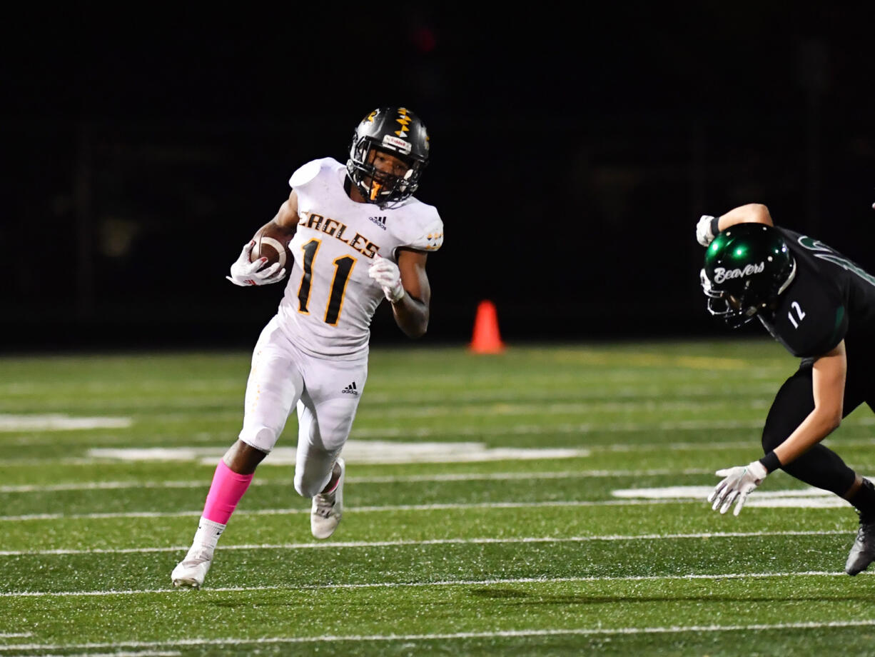 Niyjiel Brown (11) of Hudson’s Bay, gets around on a Woodland defender during Friday’s game at Woodland.