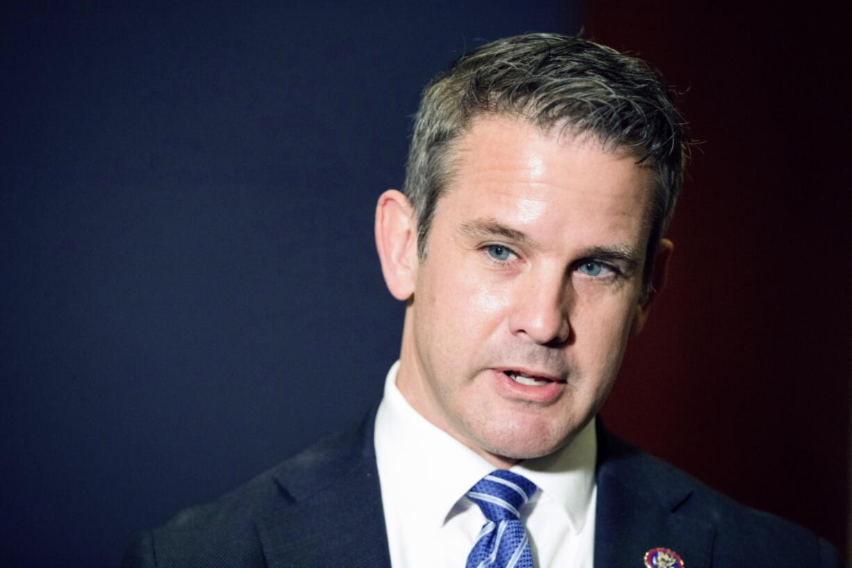 FILE - Rep. Adam Kinzinger, R-Ill., speaks to the media at the Capitol, May 12, 2021, in Washington. Kinzinger a critic of Donald Trump who is one of two Republicans on the panel investigating the deadly Capitol attack, announced Friday, Oct. 29, that he will not seek re-election next year.