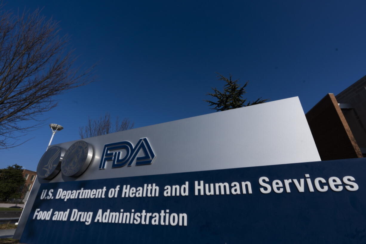 FILE- In this Dec. 10, 2020, file photo, a sign is displayed for the Food and Drug Administration in Silver Spring, Md. After nearly nine months of searching, President Joe Biden says he's close to naming his choice to lead the FDA, which oversees vaccines, drugs and tests.