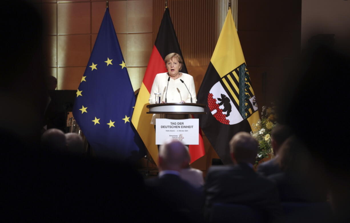 Federal Chancellor Angela Merkel (CDU) speaks at the ceremony marking German Unity Day in the Handel Hall in Halle/Saale, Sunday, Oct. 3, 2021.