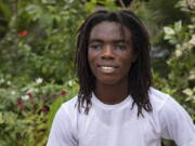 Tyrone Iras Marhguy, 17, pose for a photograph at his home in Accra, Ghana, Sunday, Oct. 10, 2021. An official at the academically elite Achimota School in Ghana told the teen he would have to cut his dreadlocks before enrolling. For Marhguy, who is a Rastafarian, cutting his dreadlocks is non-negotiable so he and his family asked the courts to intervene.