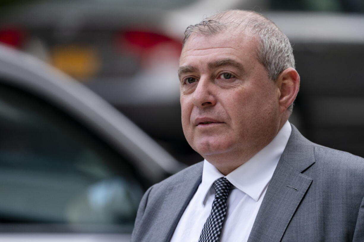 Lev Parnas walks past criminal court, Monday, Oct. 18, 2021, in New York. Parnas, a onetime associate of Rudy Giuliani, is accused along with a co-defendant of making illegal campaign contributions.