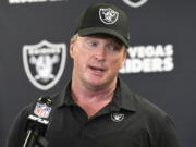 FILE - In this Sept. 19, 2021, file photo, Las Vegas Raiders head coach Jon Gruden meets with the media following an NFL football game against the Pittsburgh Steelers in Pittsburgh. Gruden is out as coach of the Raiders after emails he sent before being hired in 2018 contained racist, homophobic and misogynistic comments. A person familiar with the decision said Gruden is stepping down after The New York Times reported that Gruden frequently used misogynistic and homophobic language directed at Commissioner Roger Goodell and others in the NFL.