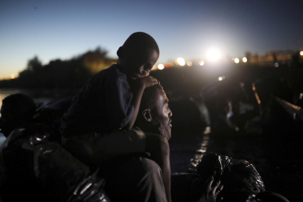 Migrants, most from Haiti, cross the Rio Grande towards Del Rio, Texas, from Ciudad Acu?a, Mexico.