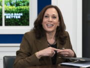 Vice President Kamala Harris, smiles at Sen. Tammy Duckworth, D-Ill., not pictured, at the conclusion of a virtual town hall where they discussed different care policies ranging from at-home medical care to childcare, Thursday, Oct. 14, 2021, in the South Court Auditorium on the White House complex in Washington.