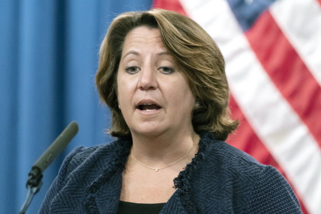 FILE - In this Sept. 30, 2021 photo, Deputy Attorney General Lisa Monaco speaks with reporters during a news conference at the Department of Justice in Washington. Monaco said the Justice Department, as part of a new initiative, is prepared to take legal action under a statute called the False Claims Act against contractors who misuse federal dollars by failing to disclose hacks or by having deficient cybersecurity standards. The department will also protect whistleblowers who come forward to report those issues.