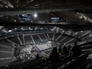 The floor and seating areas of Climate Pledge Arena are shown Wednesday, Oct. 20, 2021, during a media tour ahead of the NHL hockey Seattle Kraken's home opener Saturday against the Vancouver Canucks in Seattle. The historic angled roof of the former KeyArena was preserved, but everything else inside the venue, which will also host concerts and be the home of the WNBA Seattle Storm basketball team, is brand new. (AP Photo/Ted S.