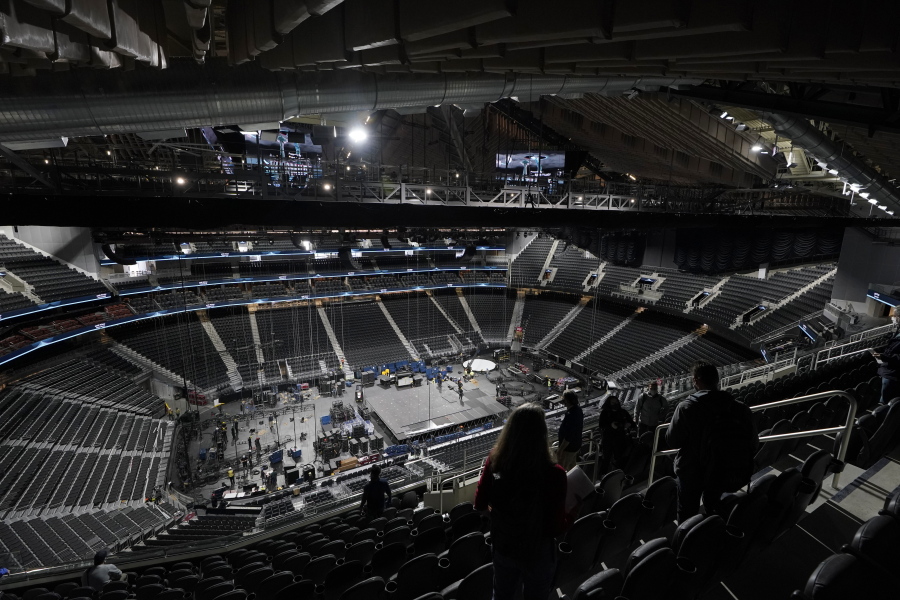 The floor and seating areas of Climate Pledge Arena are shown Wednesday, Oct. 20, 2021, during a media tour ahead of the NHL hockey Seattle Kraken's home opener Saturday against the Vancouver Canucks in Seattle. The historic angled roof of the former KeyArena was preserved, but everything else inside the venue, which will also host concerts and be the home of the WNBA Seattle Storm basketball team, is brand new. (AP Photo/Ted S.