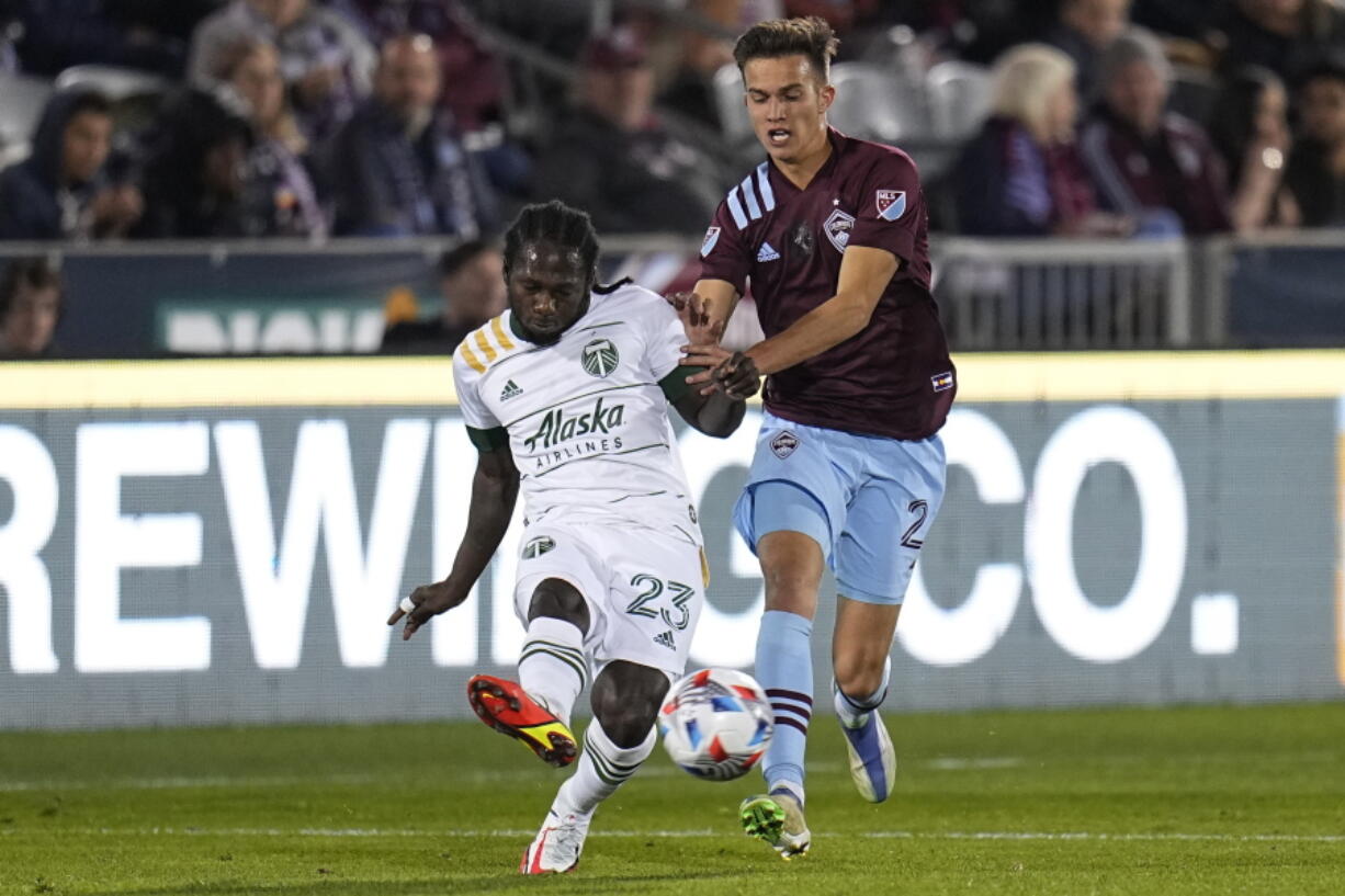 Portland Timbers forward Yimmi Chara (23) moves the ball against Colorado Rapids defender Keegan Rosenberry (2) during an MLS soccer match Saturday, Oct. 23, 2021, in Commerce City, Colo.