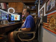 Mike Boylan works in his Oldsmar, Fla., home office. As Hurricane Ida barreled toward Louisiana in August, Boylan hit the road with live reports for his social media followers as he chased the storm.