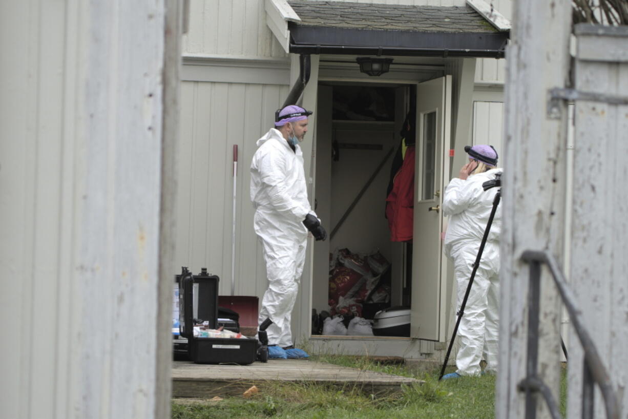 Technicians from the police investigate the apartment of the man who killed five people in a bow and arrow attack, in Kongsberg, Norway, Saturday, Oct. 16, 2021. Norwegian authorities say the bow-and-arrow rampage by a man who killed five people in a small town appeared to be a terrorist act. Police identified the attacker as Espen Andersen Braathen, a 37-year-old Danish citizen, who was arrested Wednesday night.