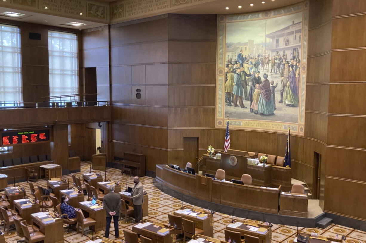 Senators talk on the floor of the Oregon Senate on Sept. 21 as the Oregon Legislature conducts a special session to work on the redistricting process.